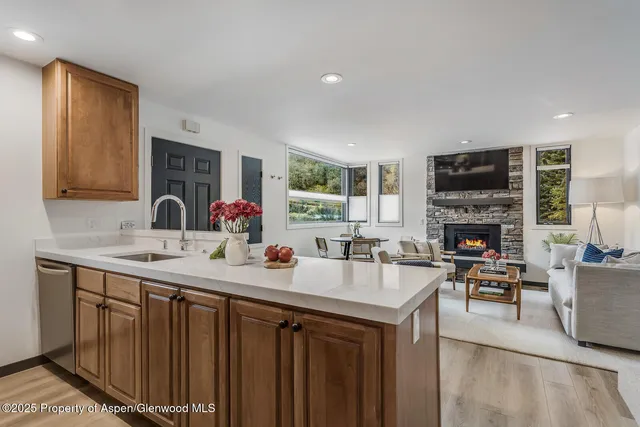 a kitchen with a sink stove and microwave