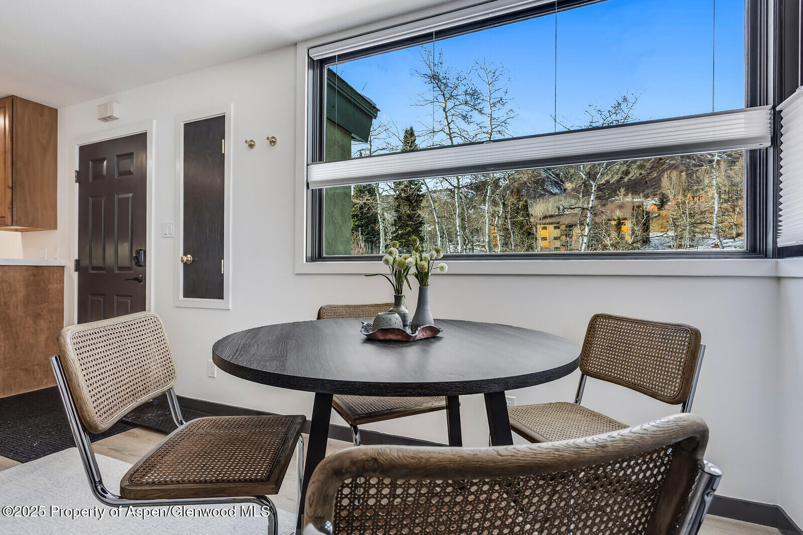 135 Carriage Way, Unit 5 Snowmass Village, CO 81615 - Photo 21 of 59 a dining room with furniture and window