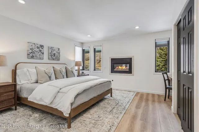 a bedroom with a bed and a night stand