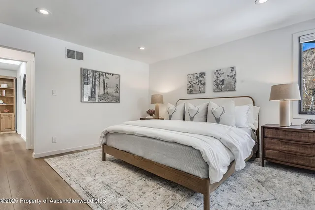 a large white bed in a white room