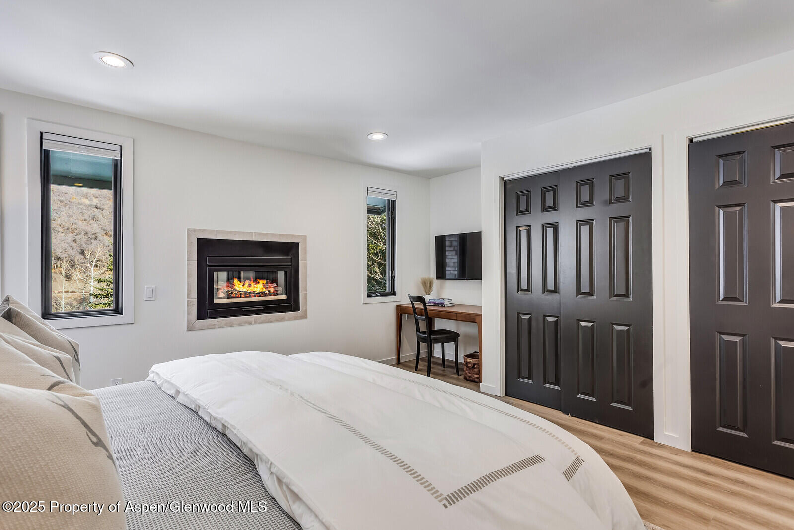 135 Carriage Way, Unit 5 Snowmass Village, CO 81615 - Photo 28 of 59 a bedroom with a bed and a dresser