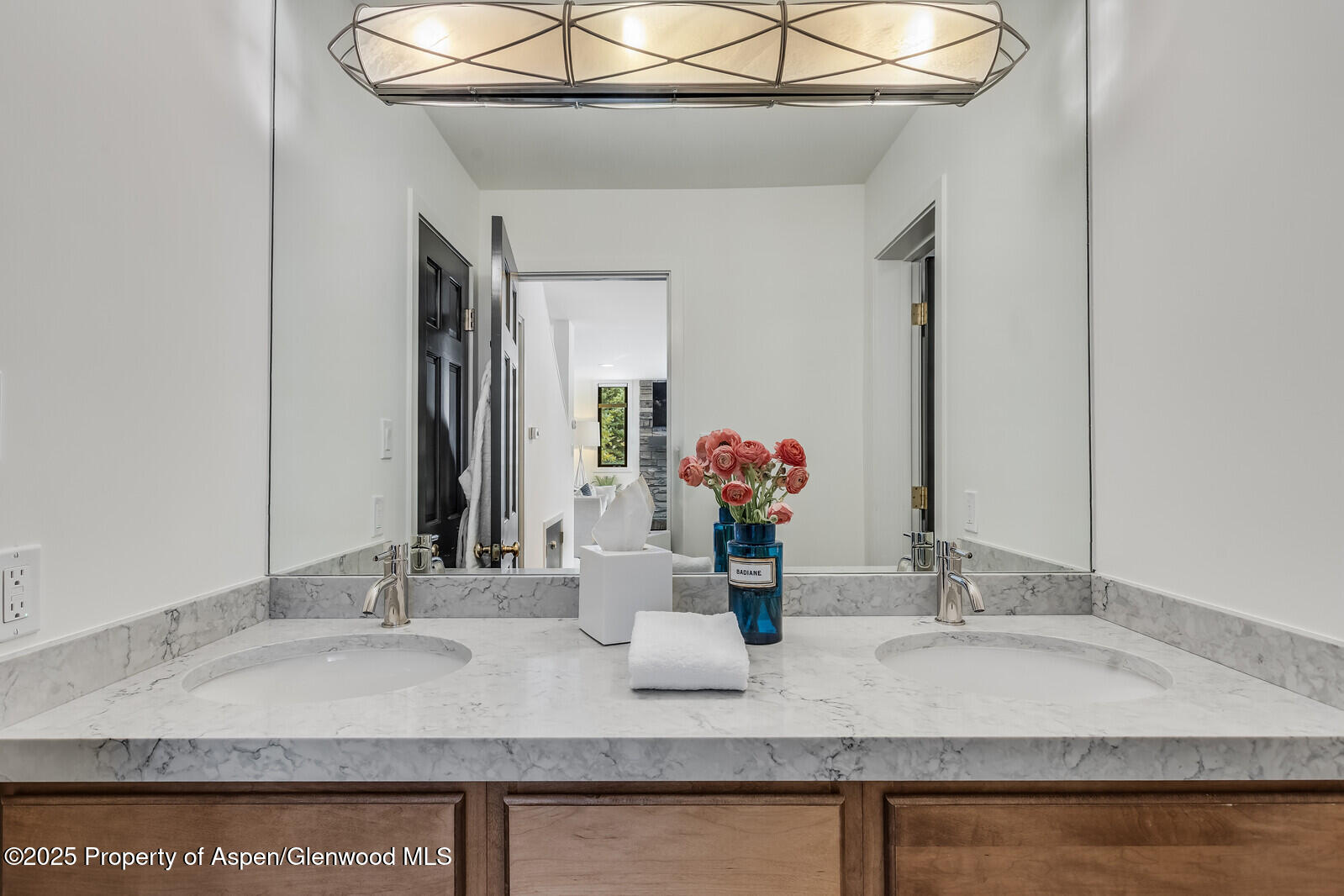135 Carriage Way, Unit 5 Snowmass Village, CO 81615 - Photo 37 of 59 a bathroom with a granite countertop sink and a mirror