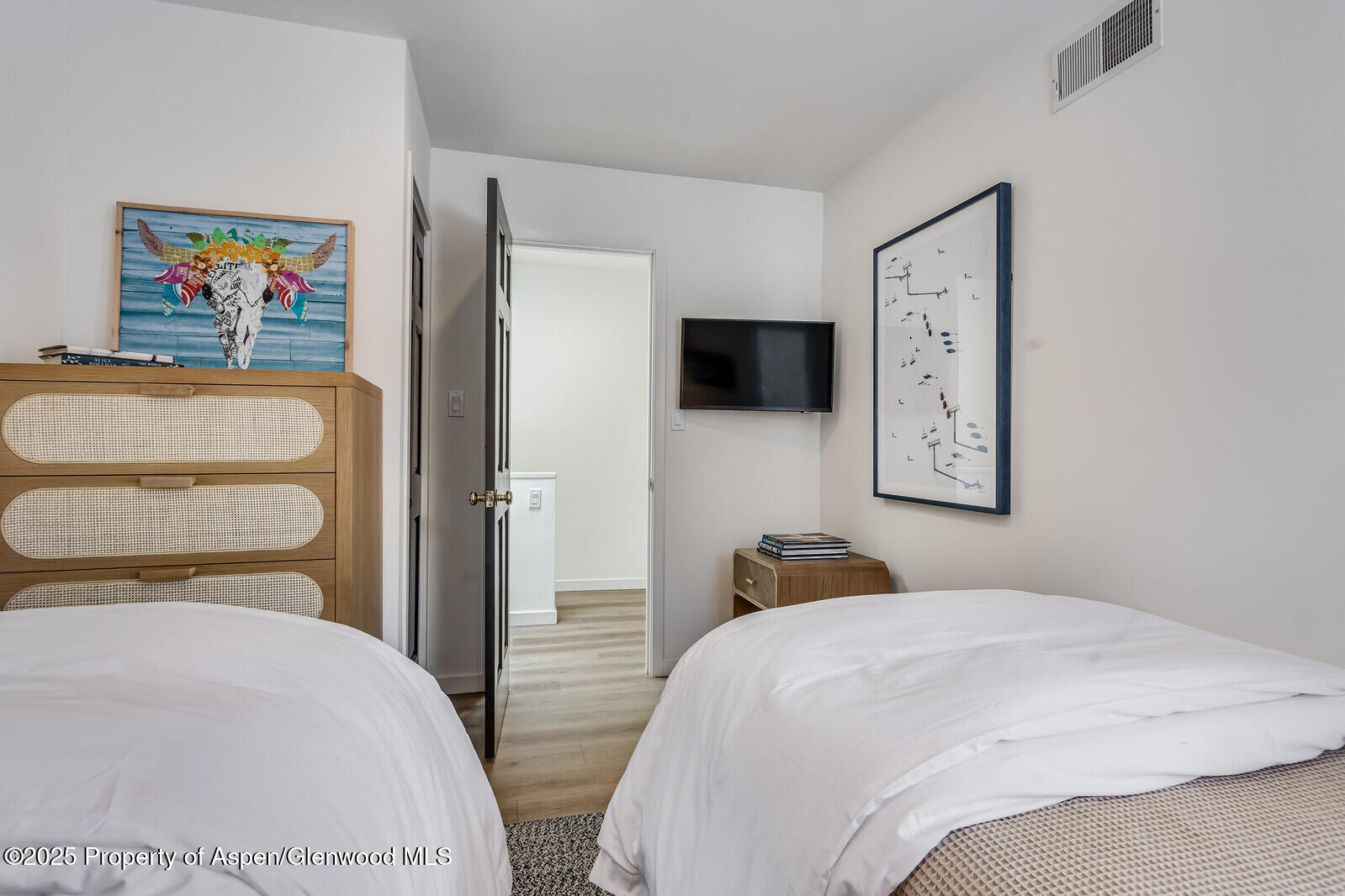 135 Carriage Way, Unit 5 Snowmass Village, CO 81615 - Photo 40 of 59 a bedroom with a bed and a flat screen tv