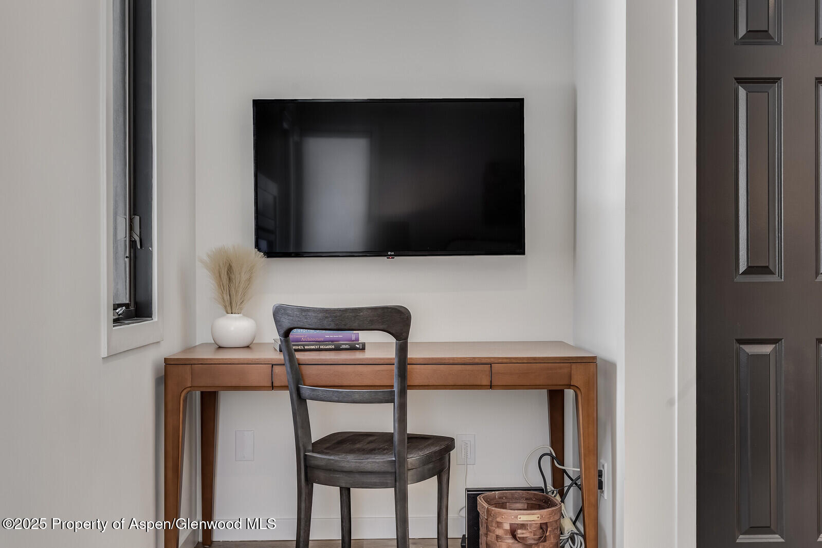 135 Carriage Way, Unit 5 Snowmass Village, CO 81615 - Photo 44 of 59 a living room with furniture and a flat screen tv