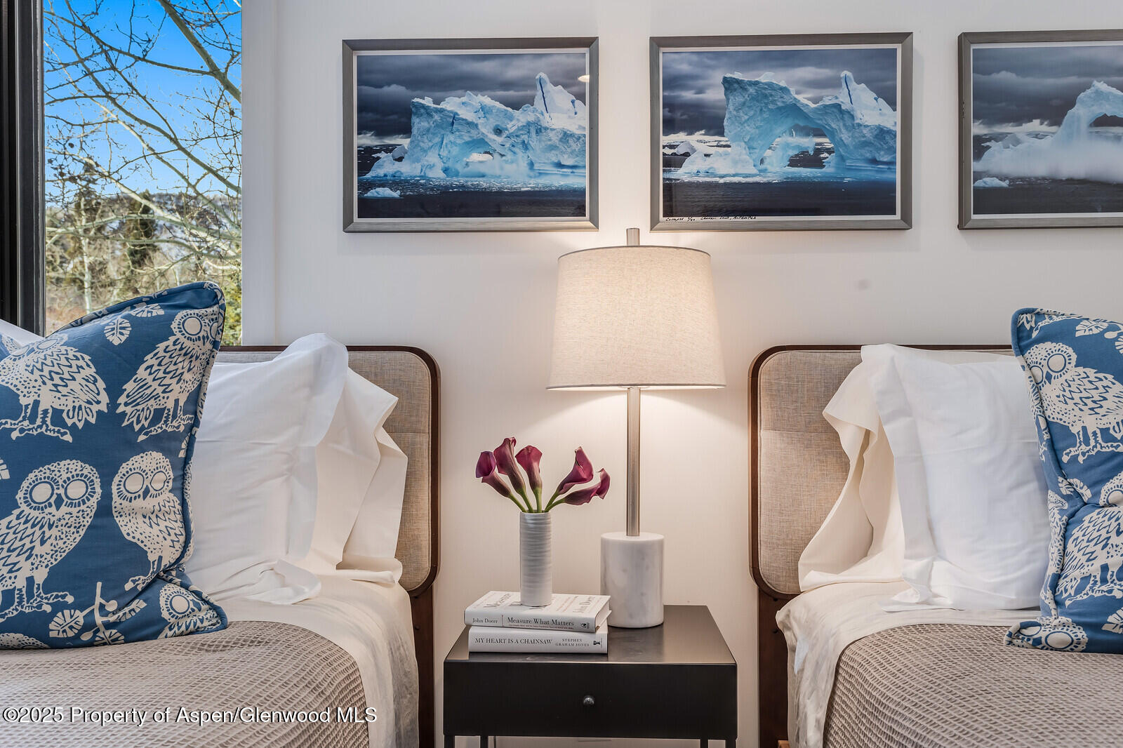 135 Carriage Way, Unit 5 Snowmass Village, CO 81615 - Photo 45 of 59 a bedroom with bed and wall painting