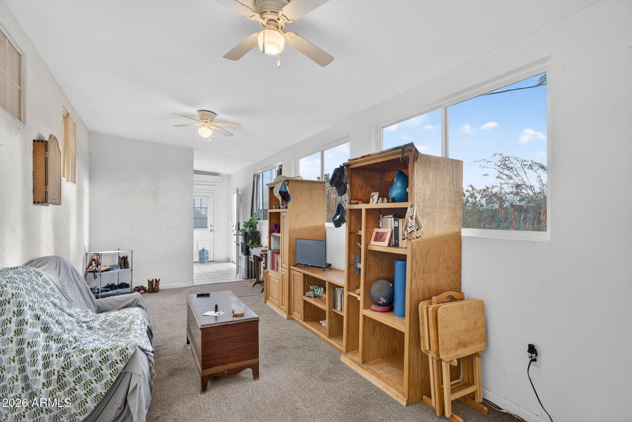 19500 West Bobcat Road Casa Grande, AZ 85122 - Photo 13 of 34 a living room with furniture and a chandelier