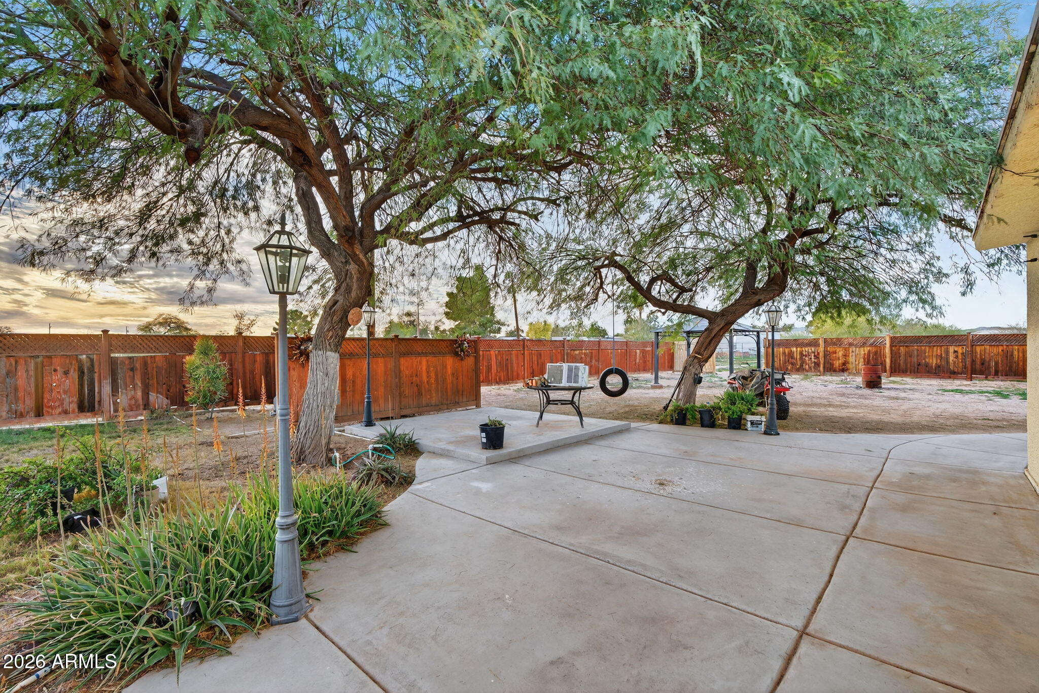 19500 West Bobcat Road Casa Grande, AZ 85122 - Photo 21 of 34 a row of palm trees in front of house