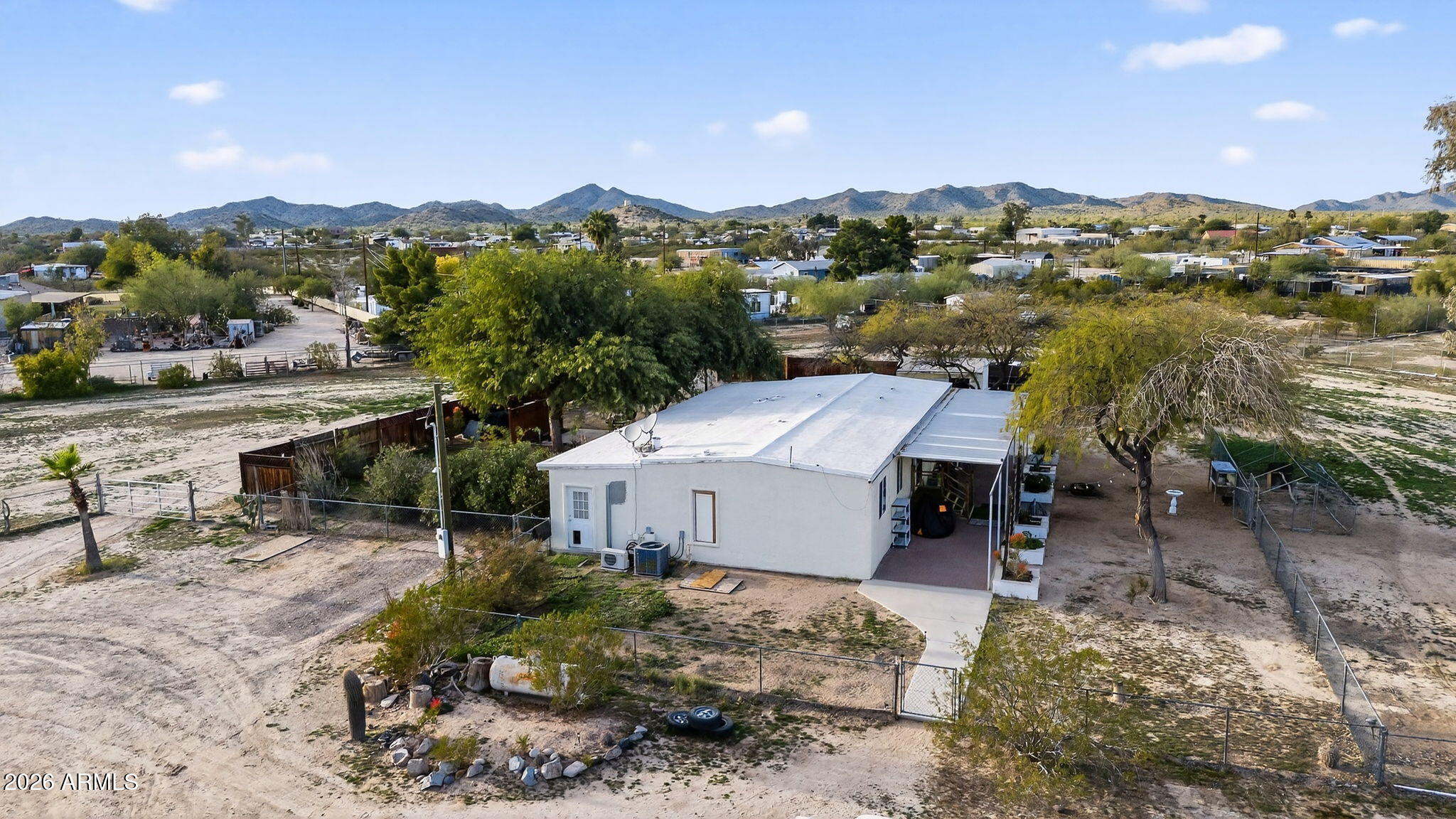 19500 West Bobcat Road Casa Grande, AZ 85122 - Photo 2 of 34 an aerial view of a house with a yard and lake view