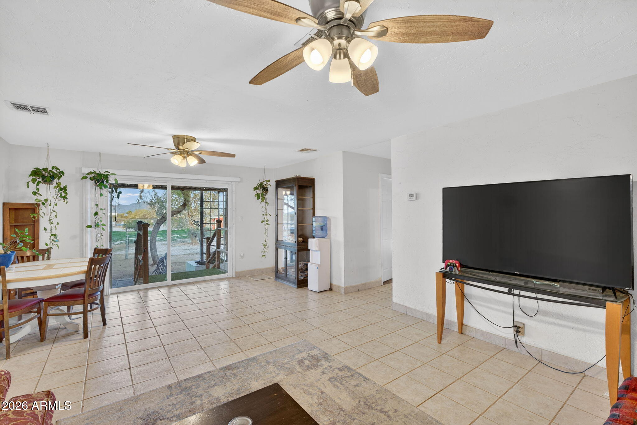 19500 West Bobcat Road Casa Grande, AZ 85122 - Photo 5 of 34 a living room with furniture and a flat screen tv
