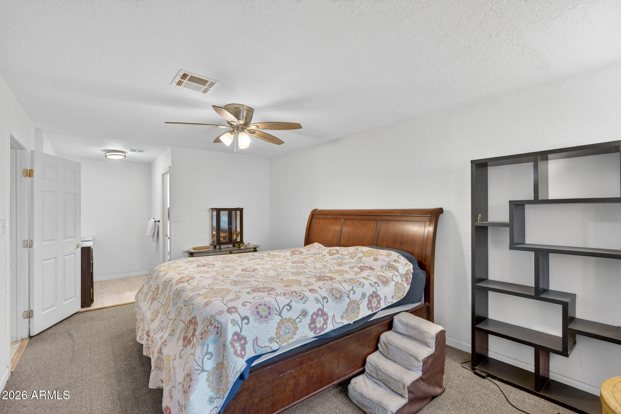 19500 West Bobcat Road Casa Grande, AZ 85122 - Photo 8 of 34 a bedroom with a bed and a lamp with potted plant
