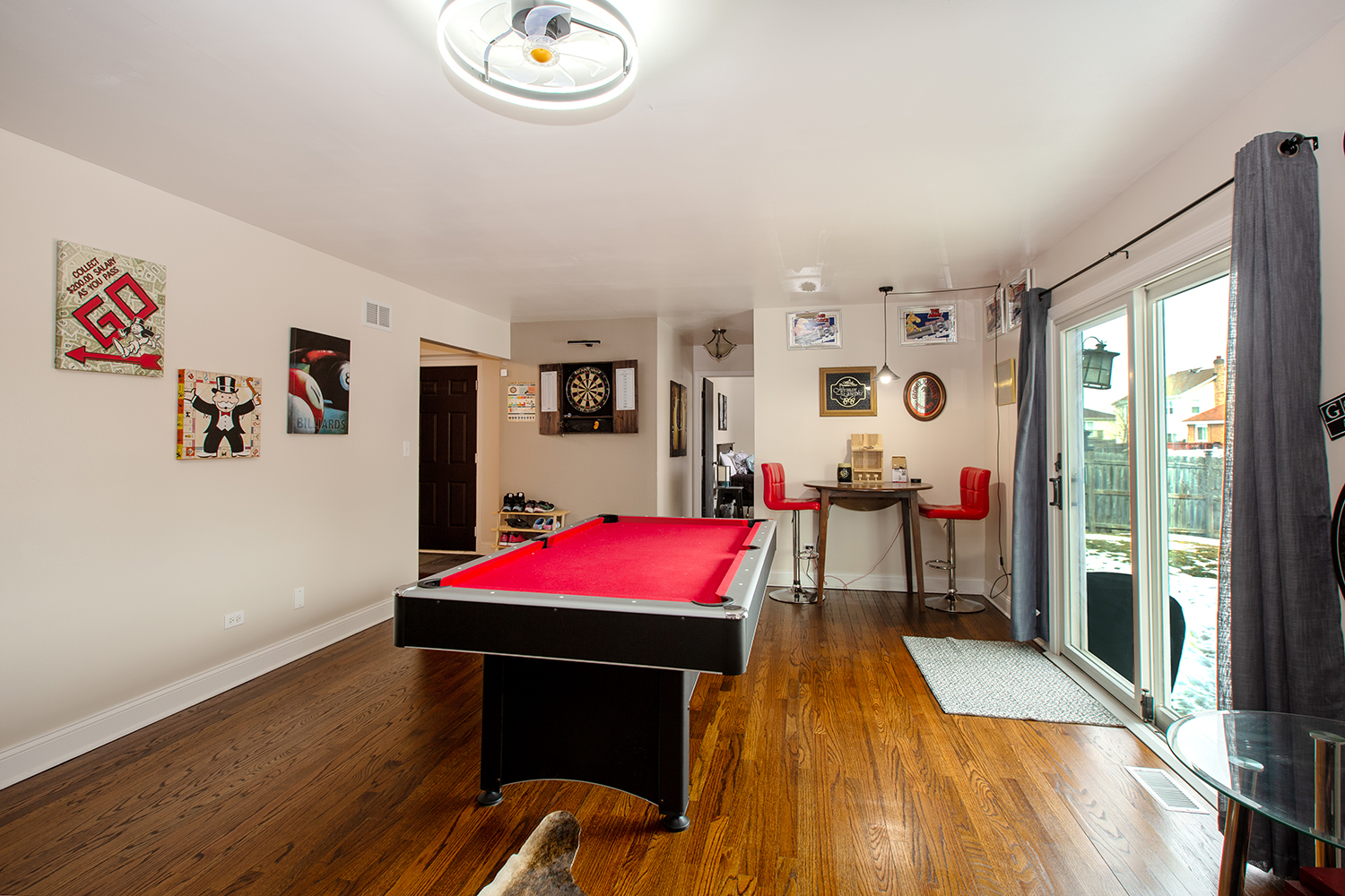 443 Danielle Road Matteson, IL 60443 - Photo 15 of 31 a room with wooden floor pool table and windows