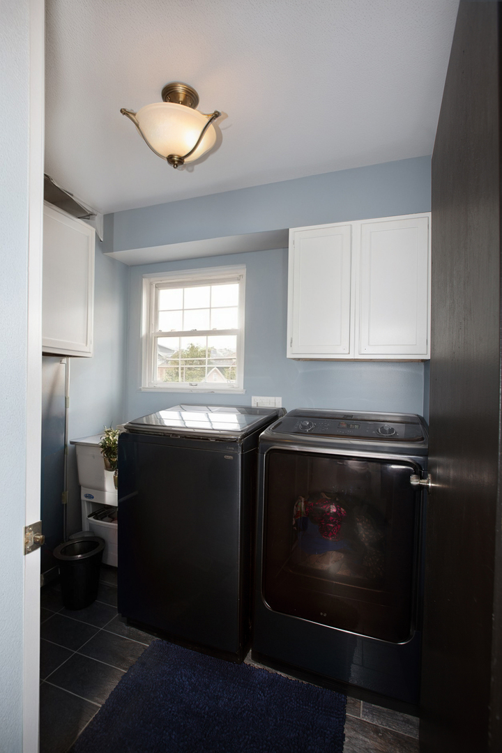 443 Danielle Road Matteson, IL 60443 - Photo 20 of 31 a kitchen with a cabinets appliances and a window