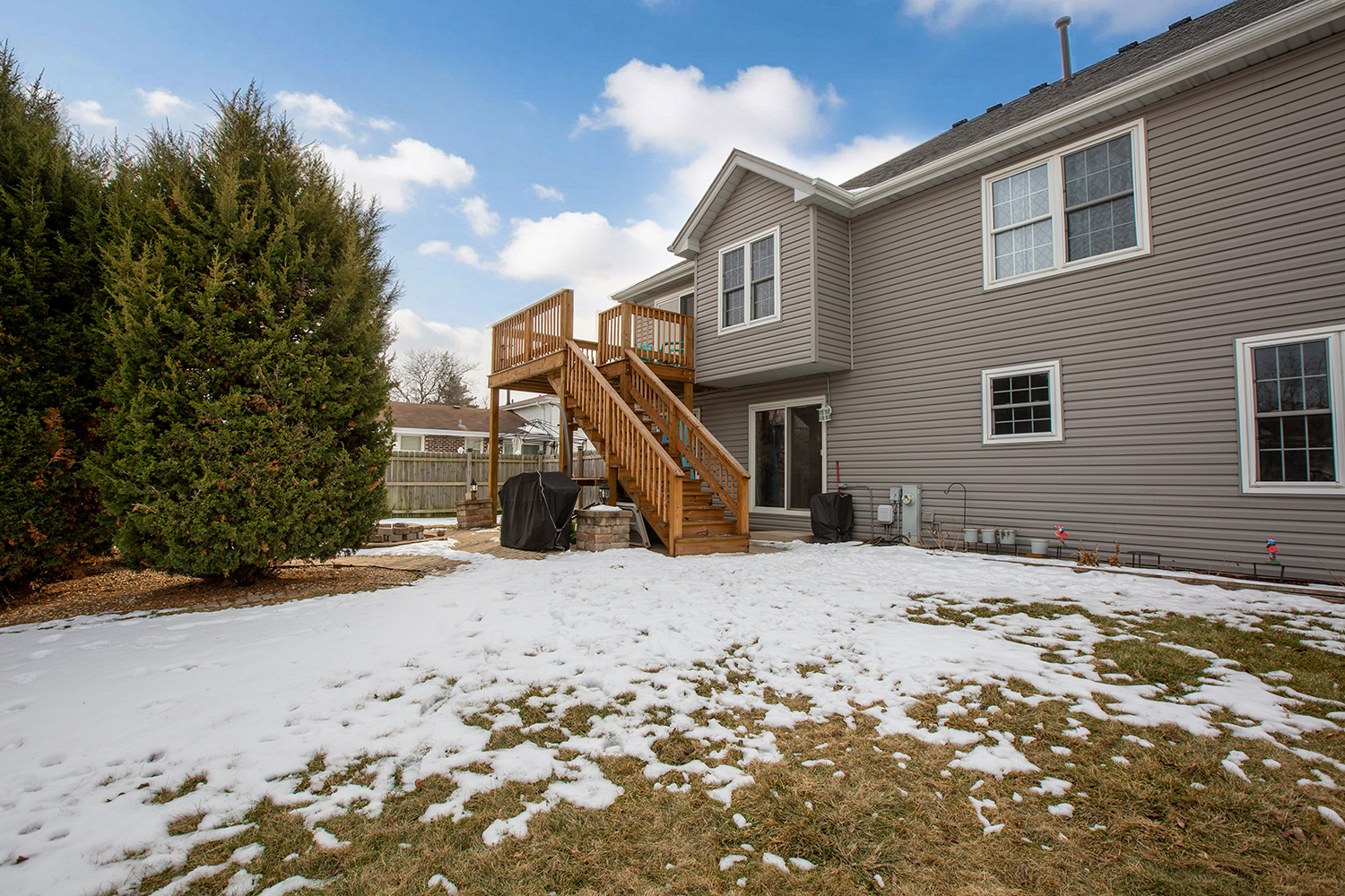 443 Danielle Road Matteson, IL 60443 - Photo 29 of 31 a tall house with a yard covered in snow