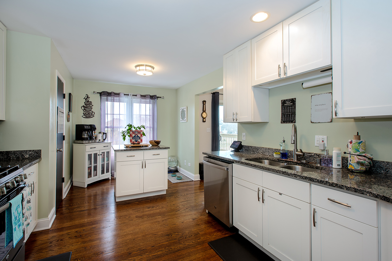 443 Danielle Road Matteson, IL 60443 - Photo 8 of 31 a kitchen with a sink white cabinets and stainless steel appliances