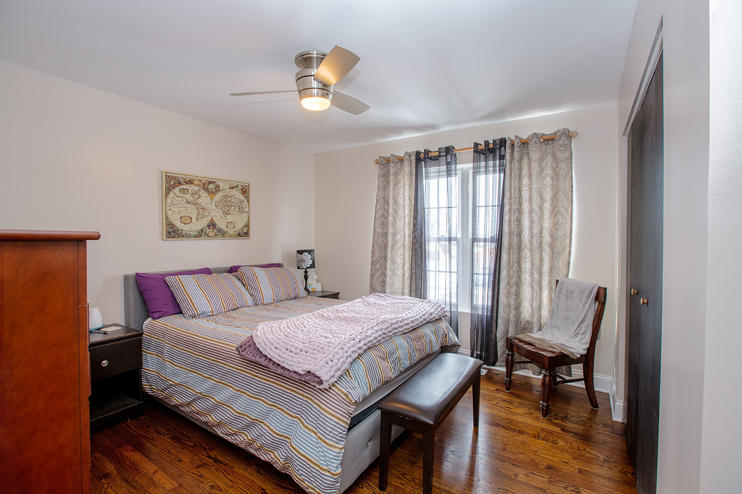 443 Danielle Road Matteson, IL 60443 - Photo 9 of 31 a bedroom with a bed and a chandelier