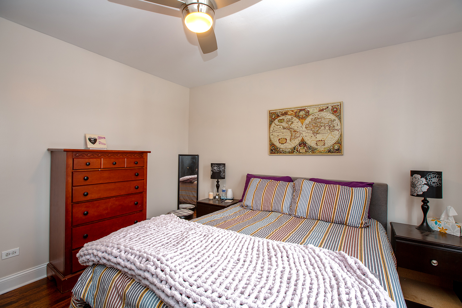 443 Danielle Road Matteson, IL 60443 - Photo 10 of 31 a bedroom with a bed and a chandelier