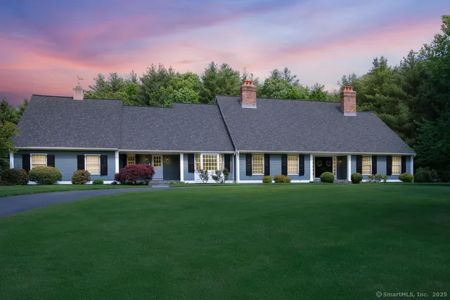 front view of a house with a garden