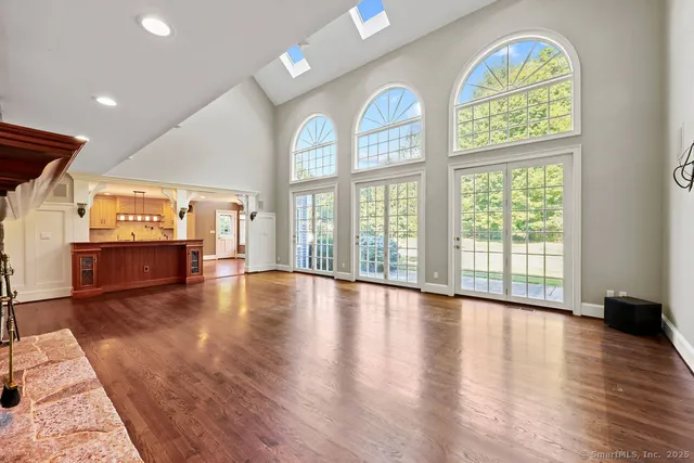 a view of an entryway with wooden floor