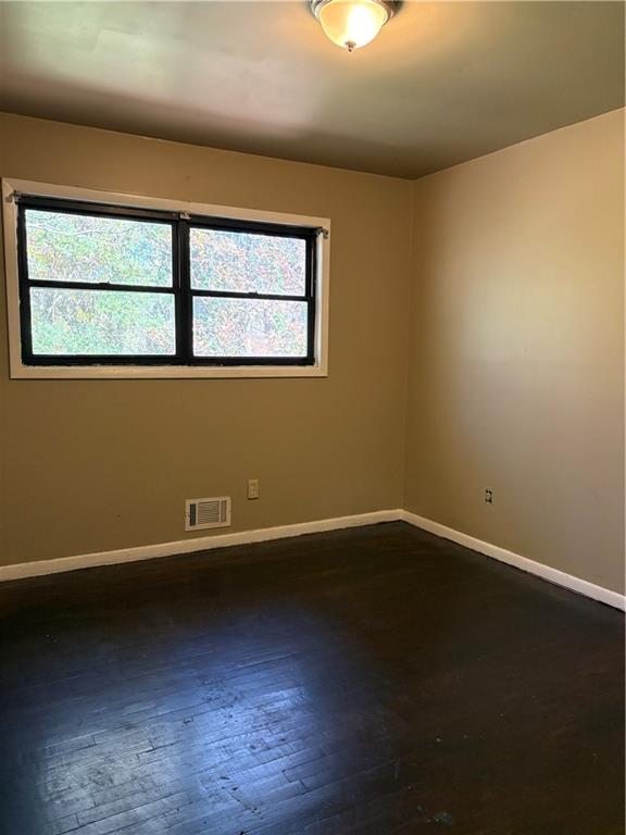 2891 Bianca Court Decatur, GA 30034 - Photo 12 of 22 a view of an empty room with wooden floor and a window