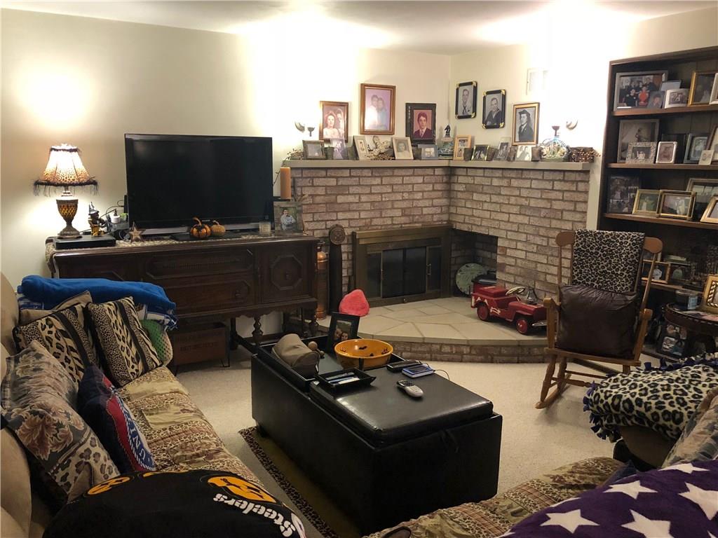 451 Slate Run Road Greensburg, PA 15601 - Photo 19 of 25 Cozy lower level game room with a gas fireplace.