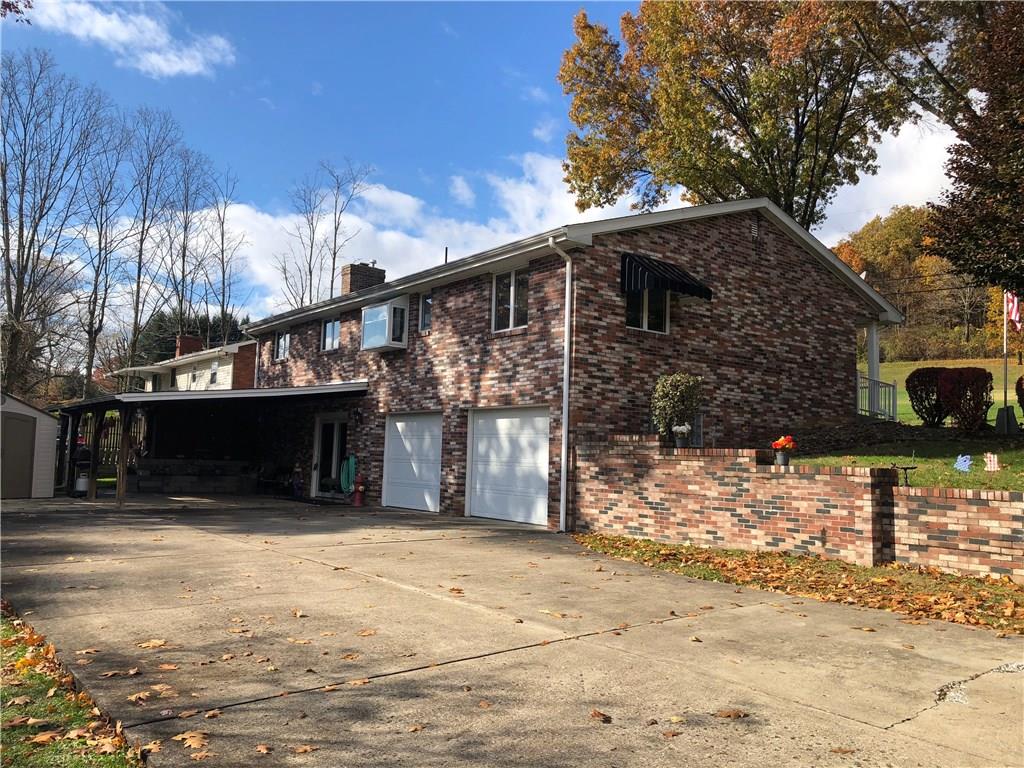 451 Slate Run Road Greensburg, PA 15601 - Photo 3 of 25 Large concrete drive way and covered patio for all of your entertaining!