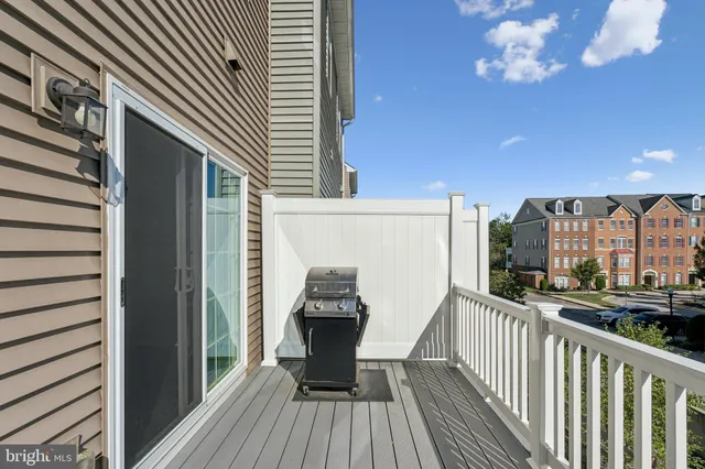 a view of a balcony with wooden floor