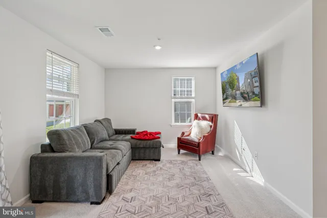 a living room with furniture and a couch