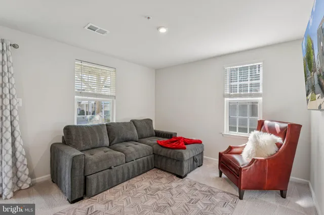 a view of room with furniture and flat screen tv