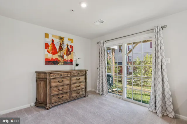 a view of a room with wooden floor and bathroom