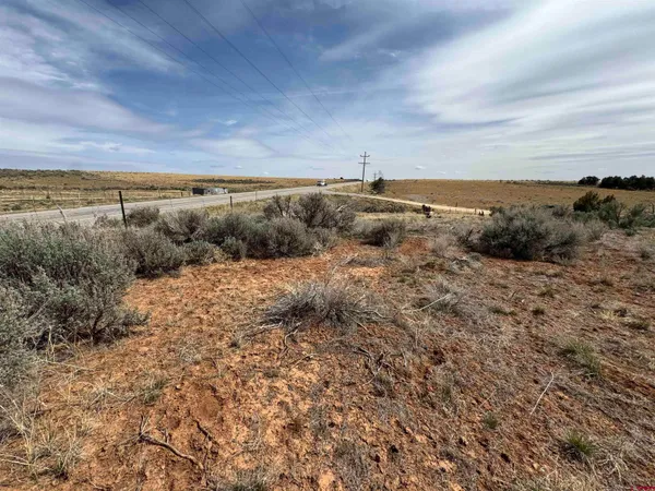 a view of dirt and mountain
