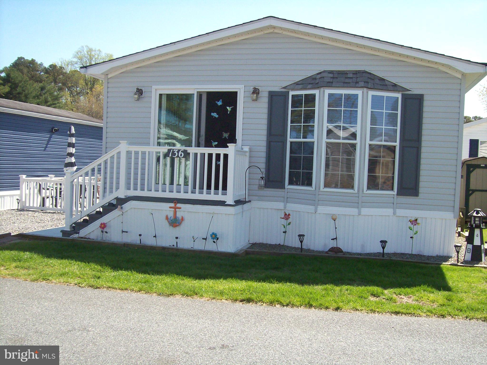 136 Salt Spray Drive Berlin, MD 21811 - Photo 1 of 39 front view of a house with a yard