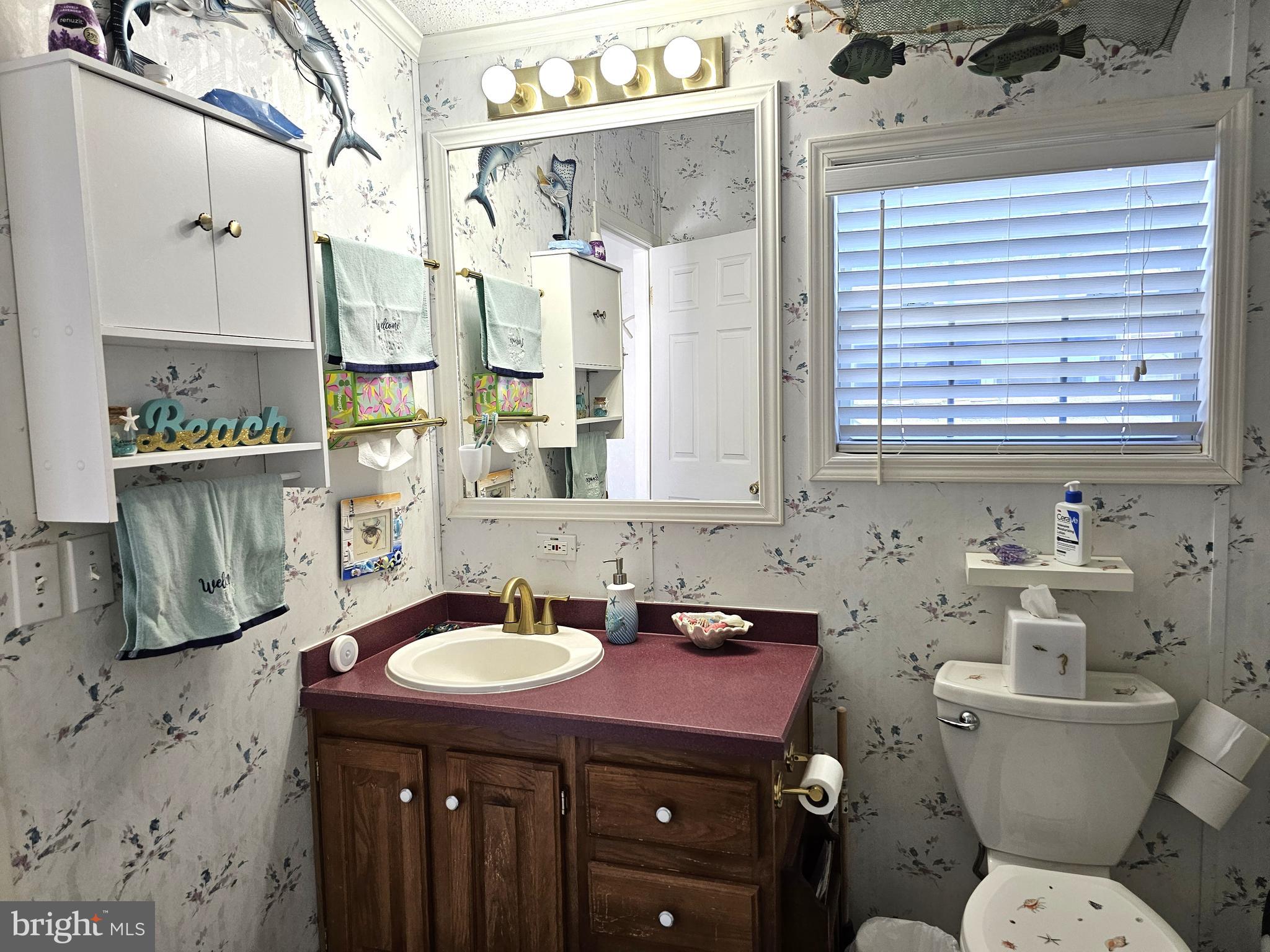 136 Salt Spray Drive Berlin, MD 21811 - Photo 20 of 39 a bathroom with a sink toilet and shower