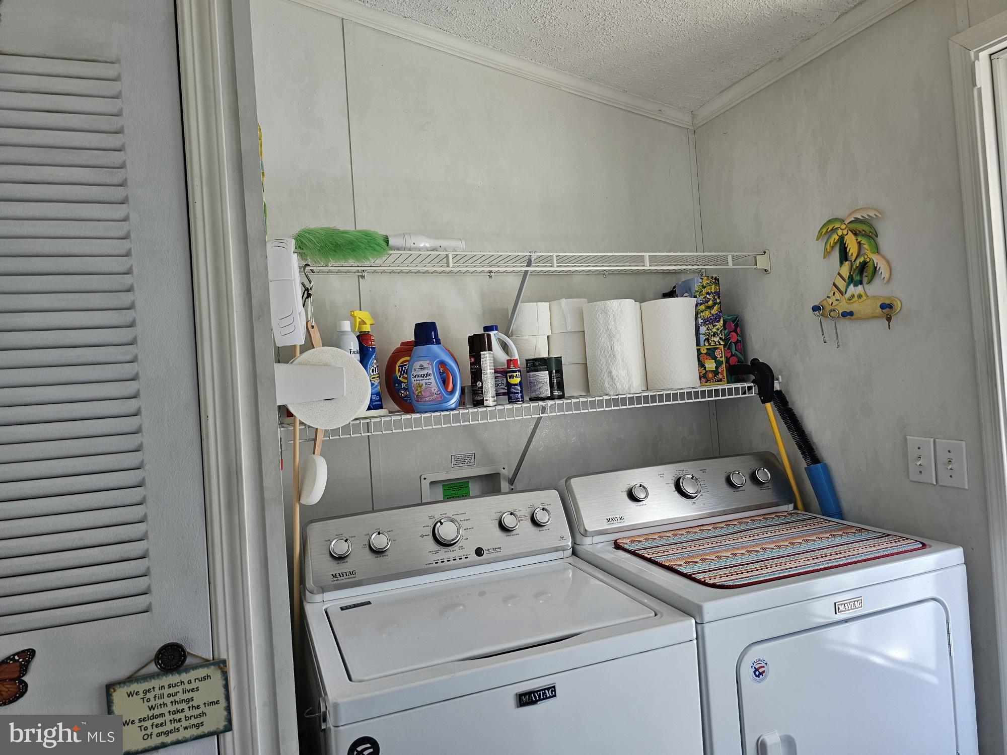 136 Salt Spray Drive Berlin, MD 21811 - Photo 22 of 39 a utility room with dryer and washer