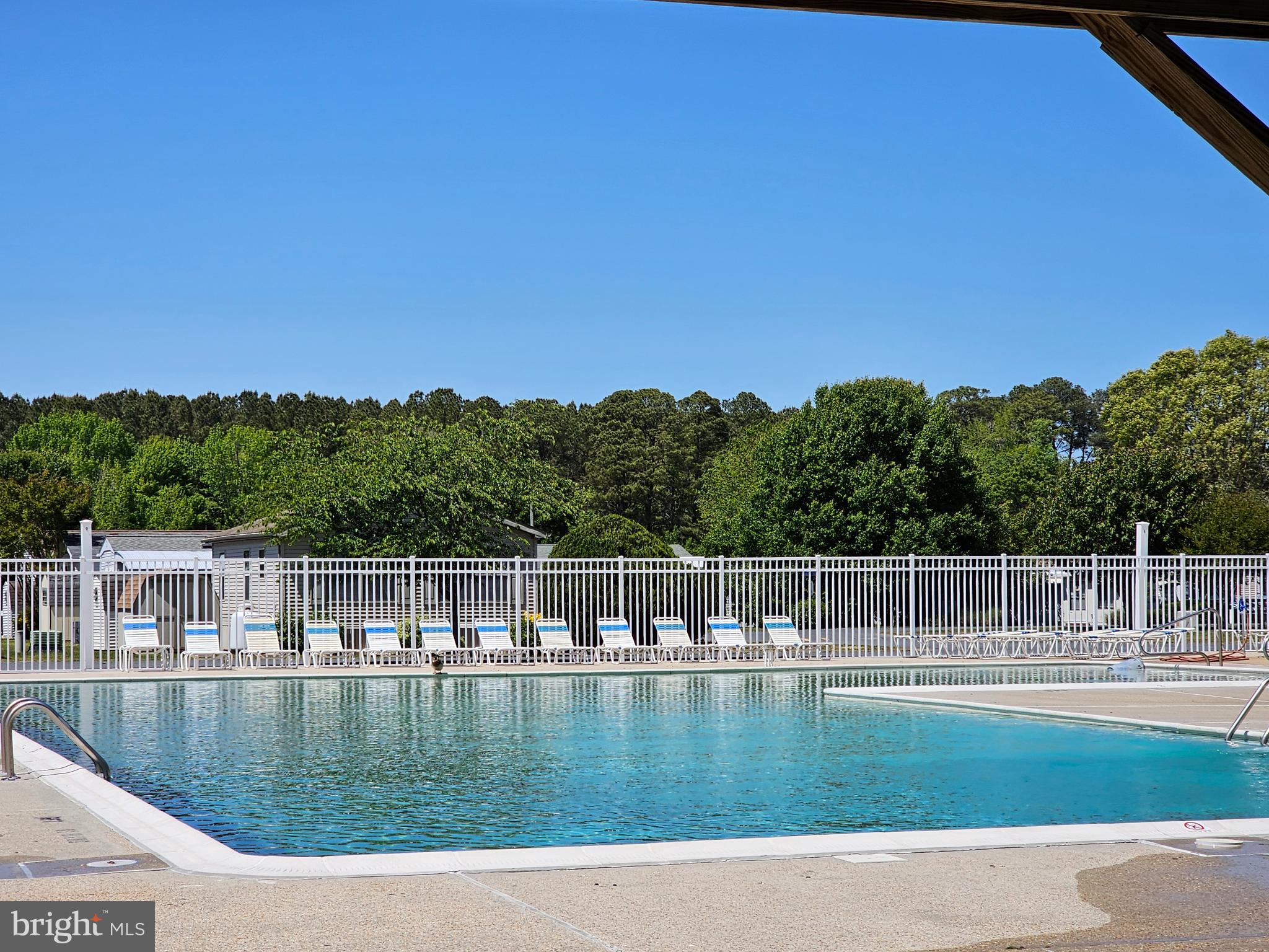 136 Salt Spray Drive Berlin, MD 21811 - Photo 26 of 39 a view of a swimming pool with a yard