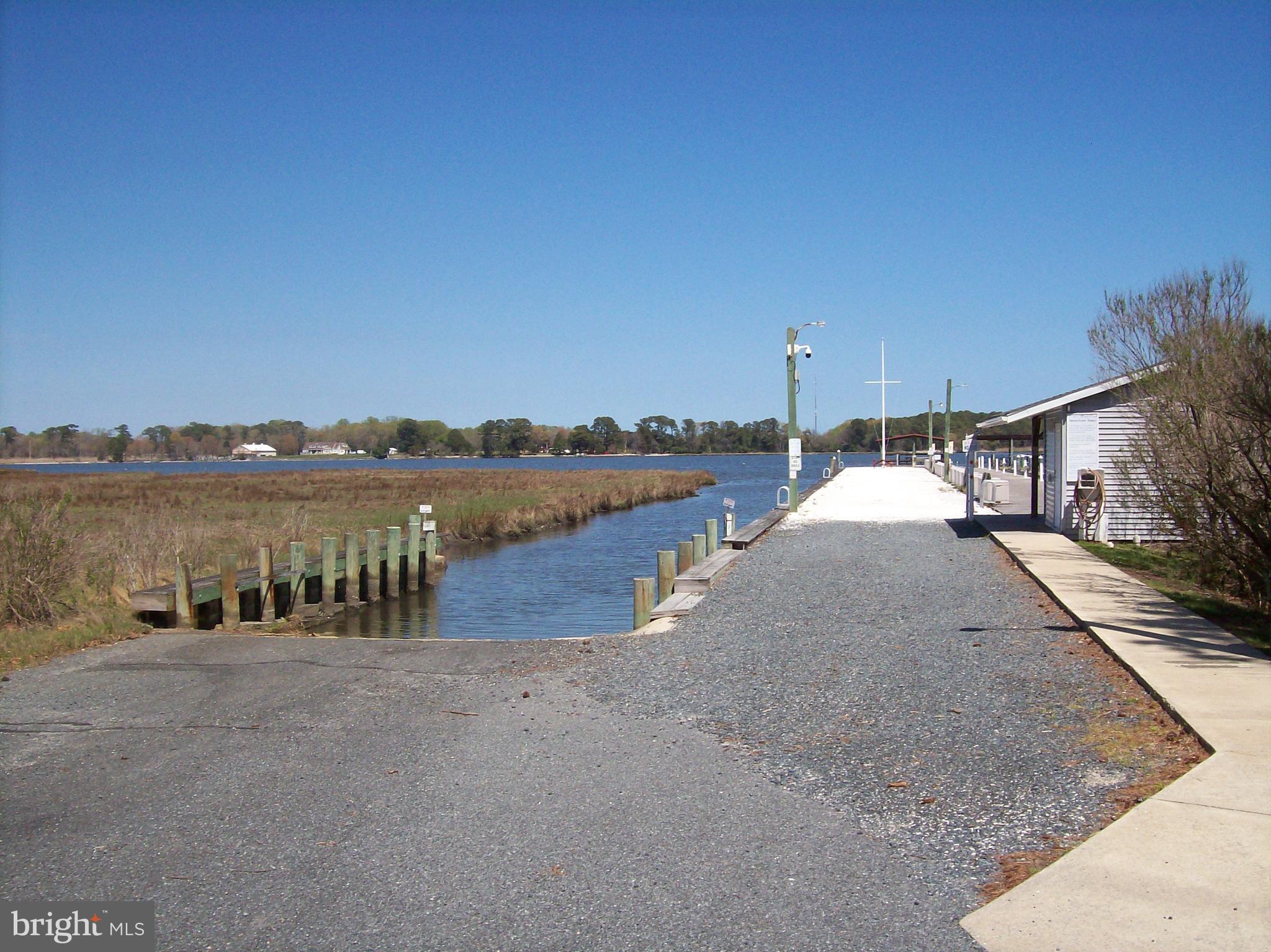 136 Salt Spray Drive Berlin, MD 21811 - Photo 27 of 39 a view of a lake with houses in background