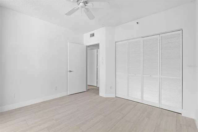a view of a hallway with a bathroom
