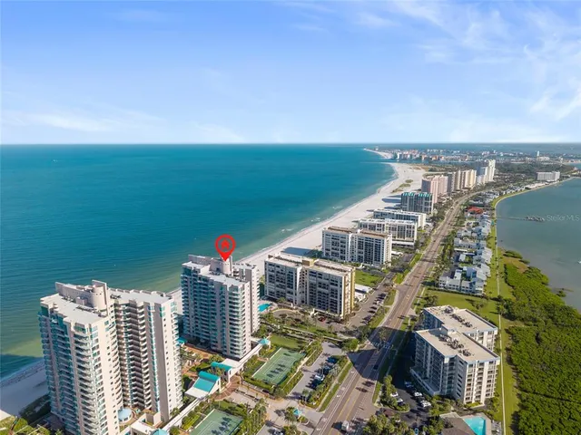 an aerial view of a house with a lake view