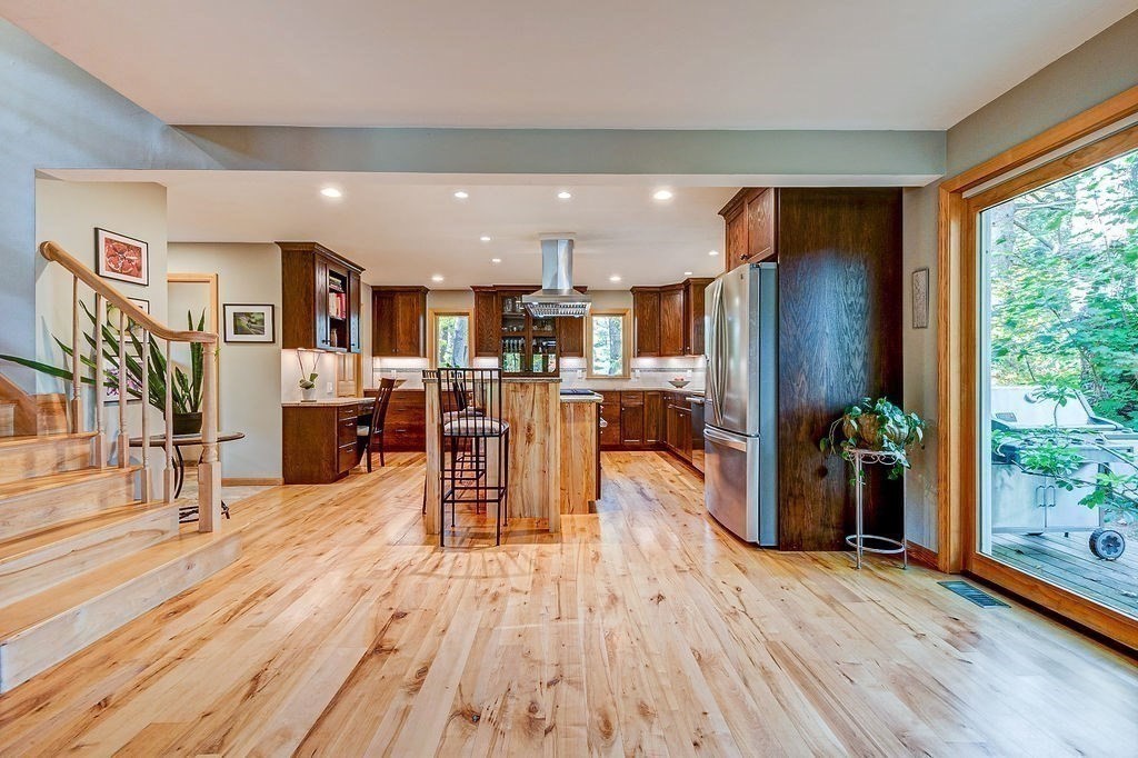 68 Hudson Road Bolton, MA 01740 - Photo 10 of 29 a living room with stainless steel appliances furniture wooden floor and a large window