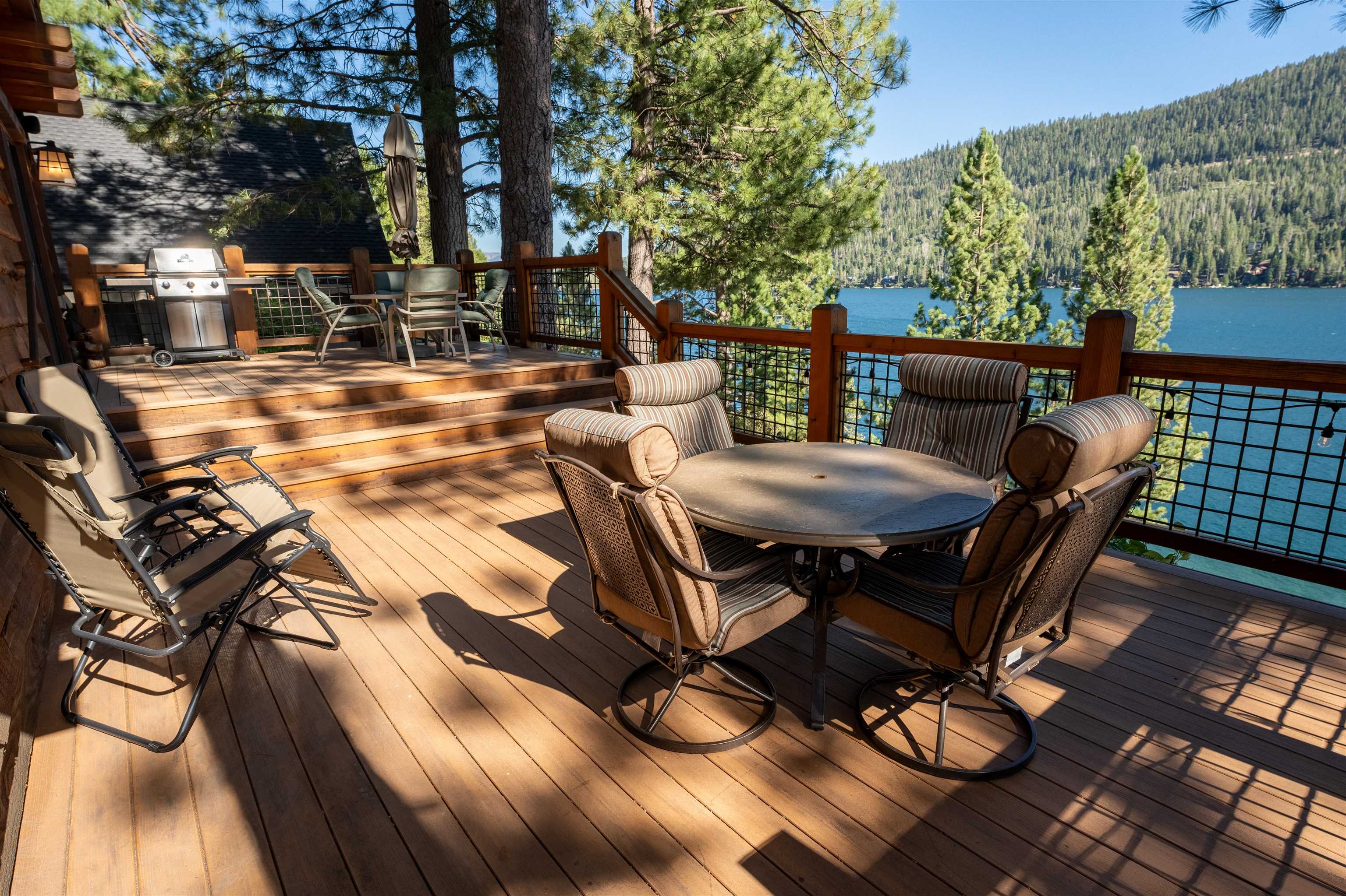 14942 Donner Pass Road Truckee, CA 96161 - Photo 12 of 21 a view of a patio with table and chairs with wooden floor and fence