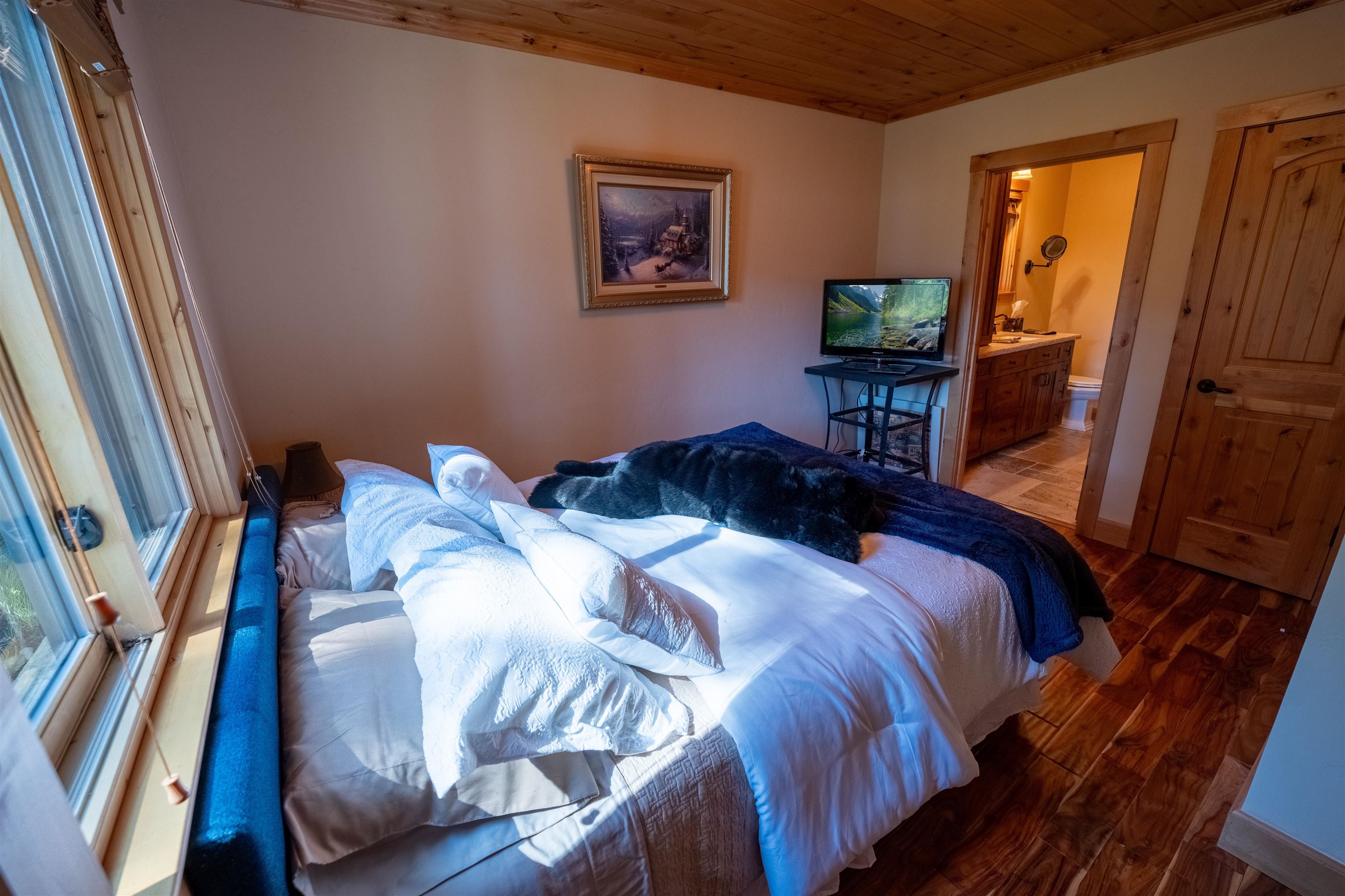 14942 Donner Pass Road Truckee, CA 96161 - Photo 15 of 21 a bedroom with a bed and a window