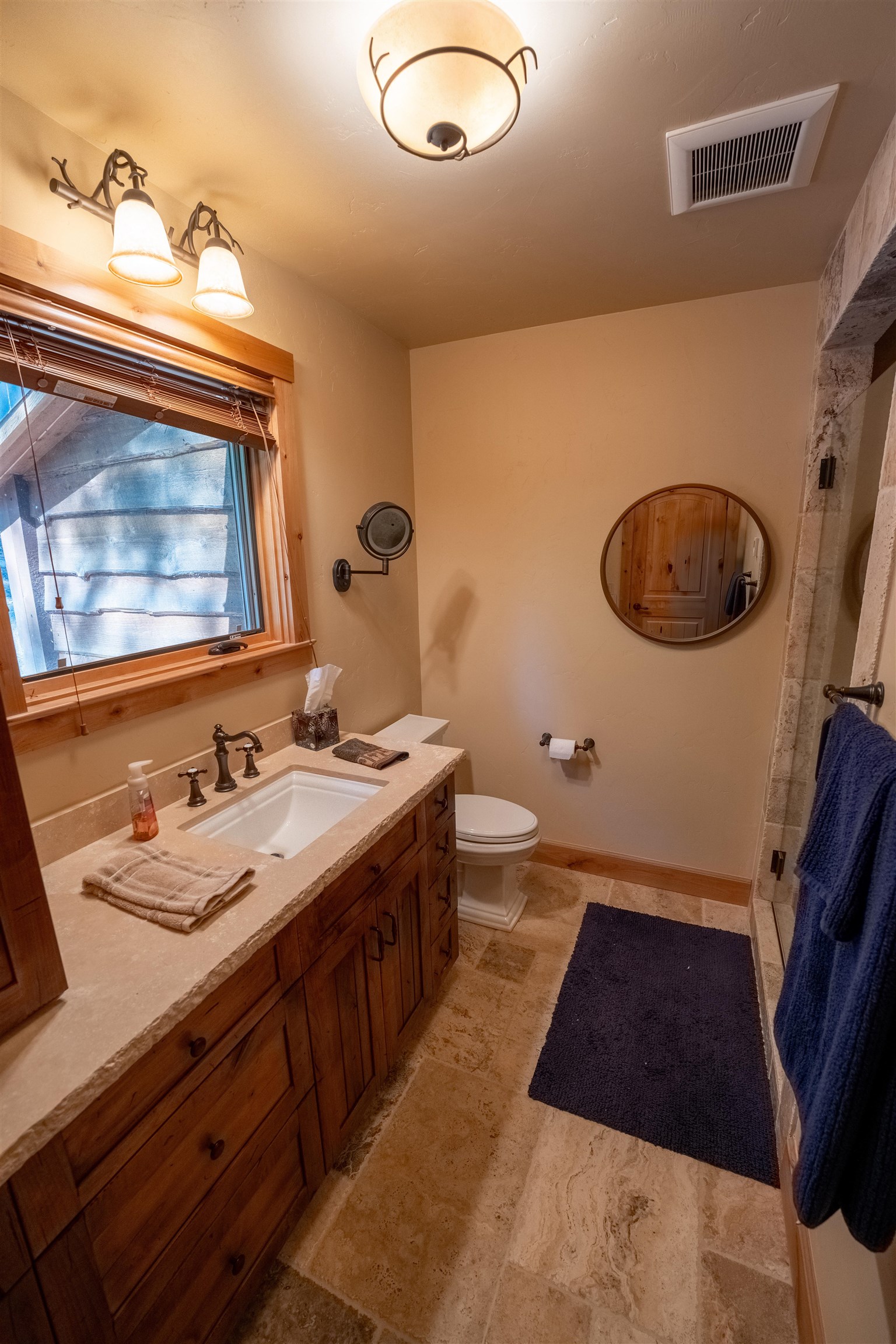 14942 Donner Pass Road Truckee, CA 96161 - Photo 18 of 21 a bathroom with a sink and a mirror