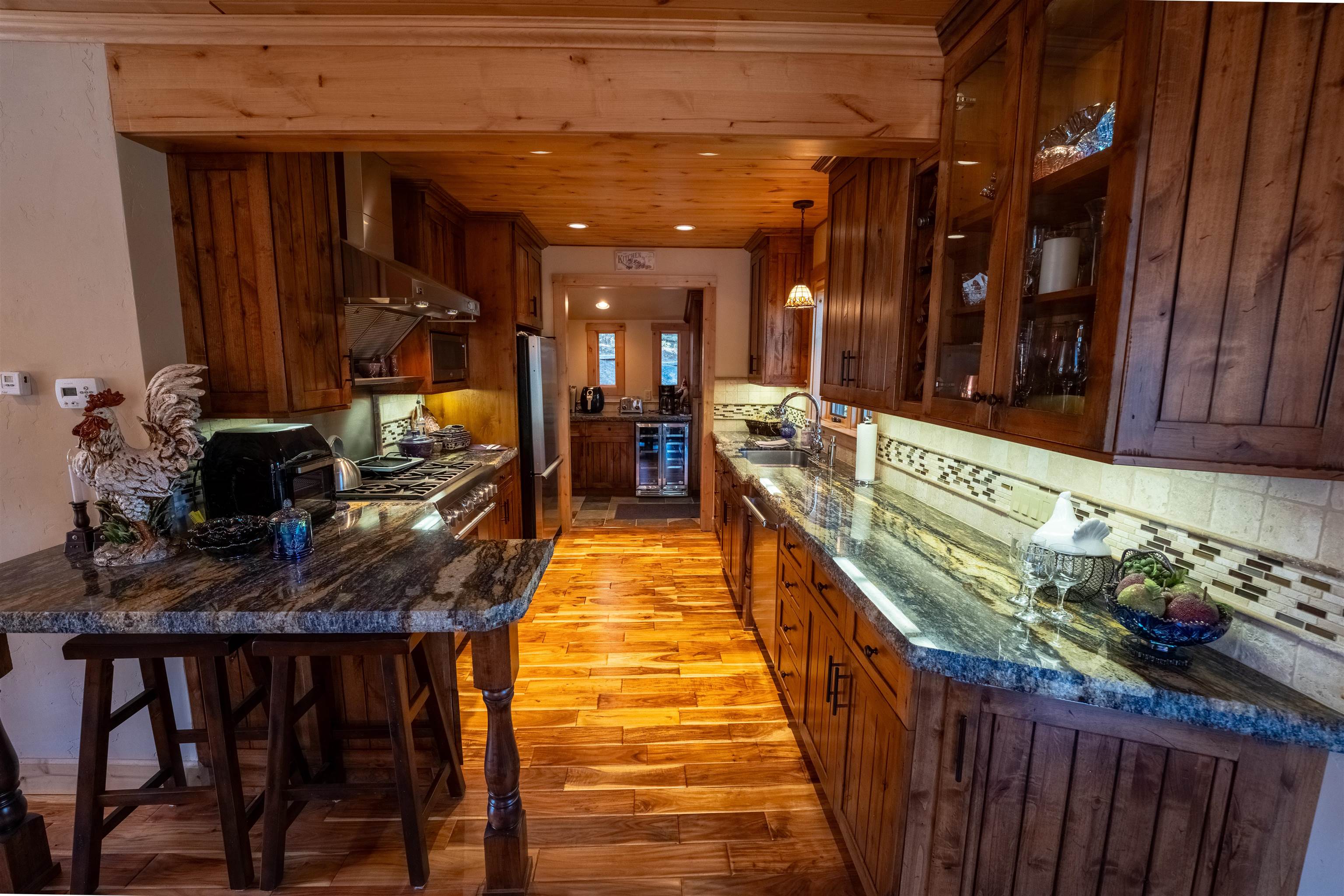 14942 Donner Pass Road Truckee, CA 96161 - Photo 4 of 21 a dining room with furniture and wooden floor