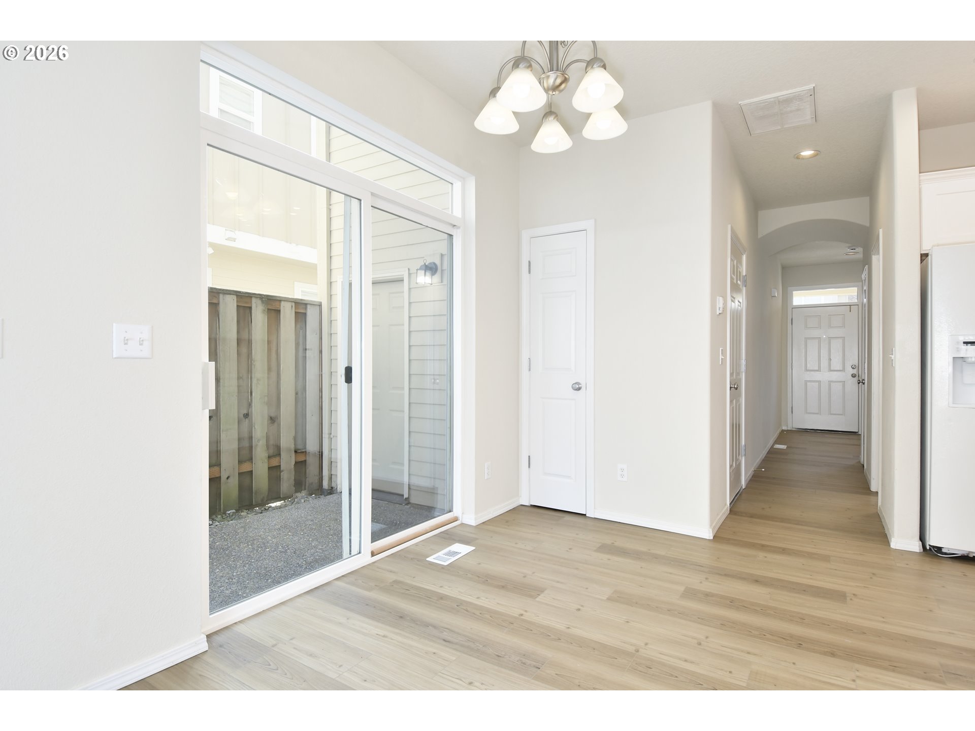 20477 Southwest Marimar Street Beaverton, OR 97078 - Photo 12 of 28 a view of an empty room with wooden floor