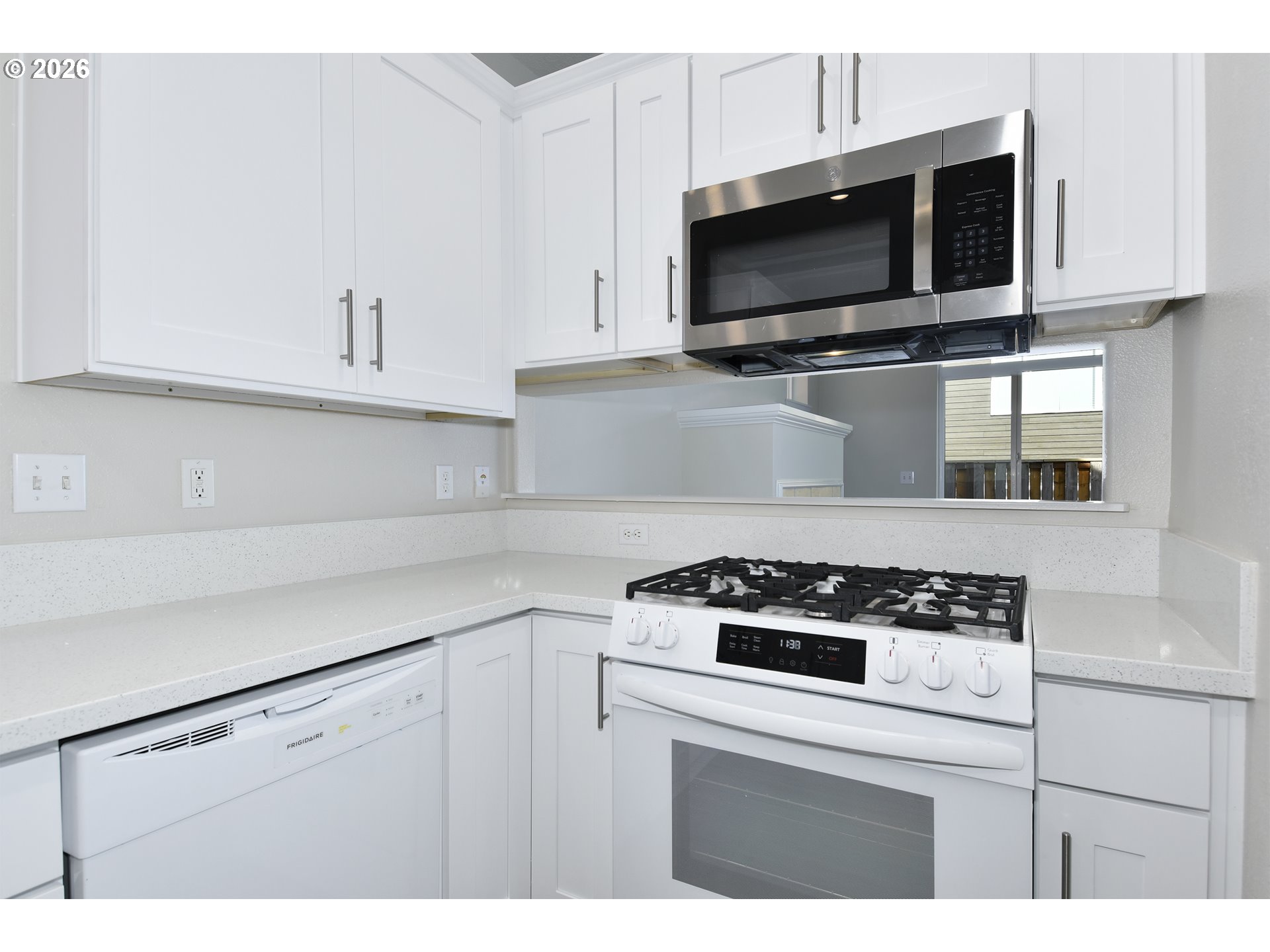20477 Southwest Marimar Street Beaverton, OR 97078 - Photo 14 of 28 a kitchen with cabinets appliances and a sink