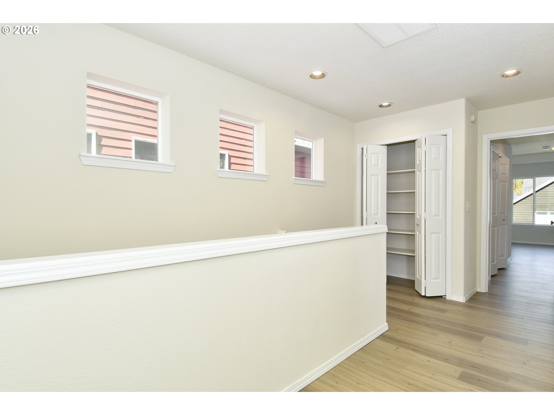 20477 Southwest Marimar Street Beaverton, OR 97078 - Photo 15 of 28 a view of empty room with wooden floor