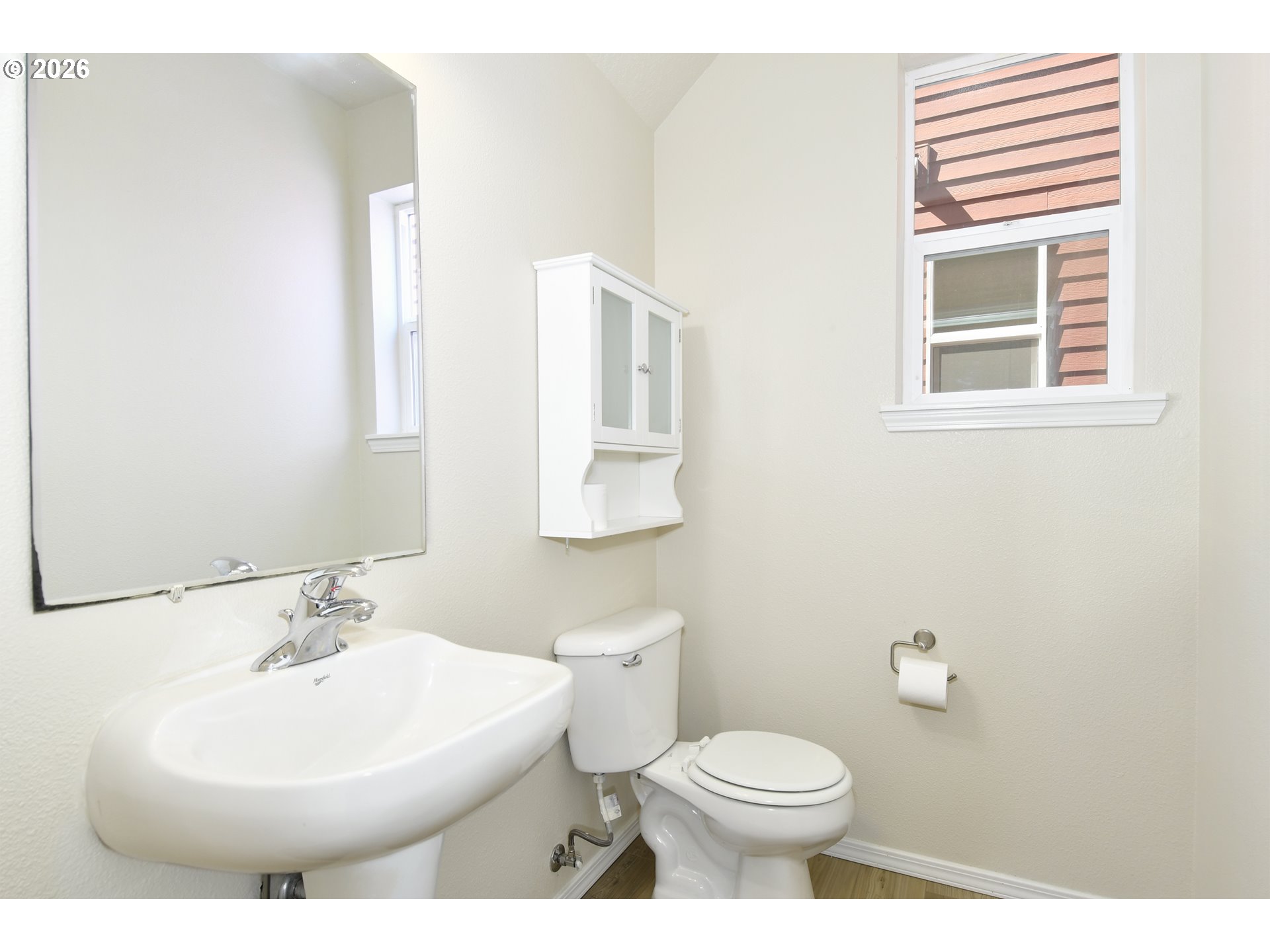 20477 Southwest Marimar Street Beaverton, OR 97078 - Photo 17 of 28 a bathroom with a sink a mirror and a toilet