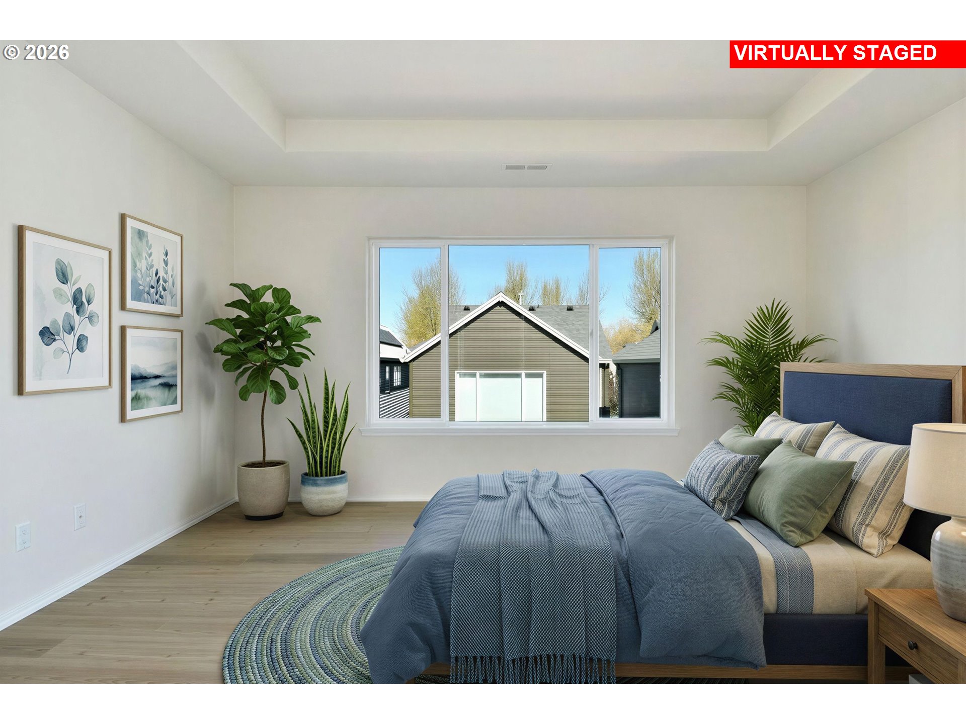 20477 Southwest Marimar Street Beaverton, OR 97078 - Photo 18 of 28 a bedroom with a large bed and a potted plant