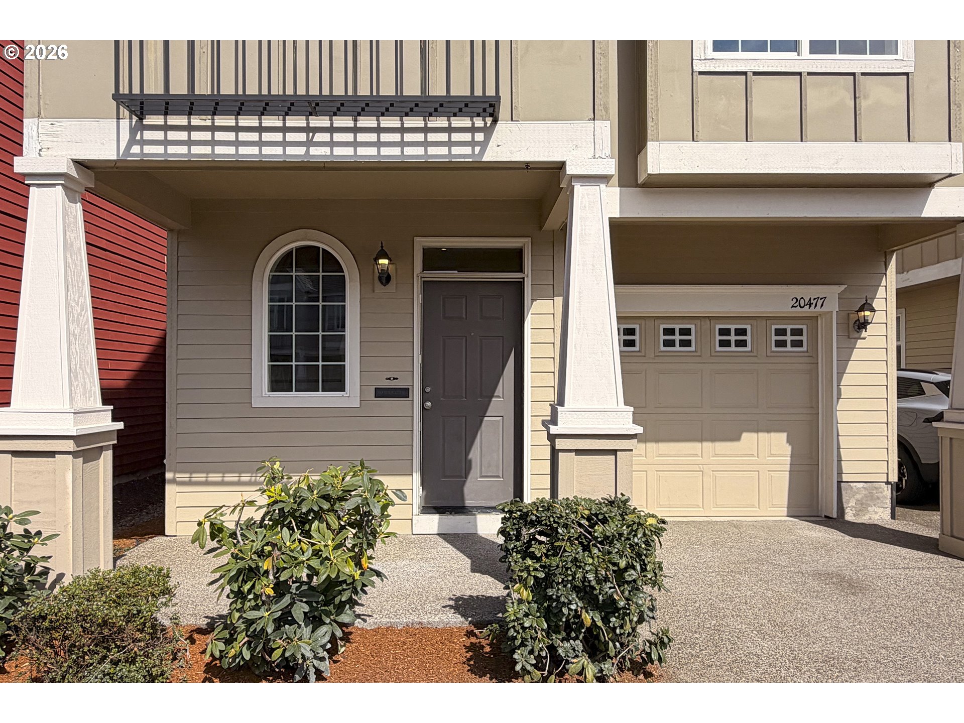 20477 Southwest Marimar Street Beaverton, OR 97078 - Photo 2 of 28 a front view of a house with a garden