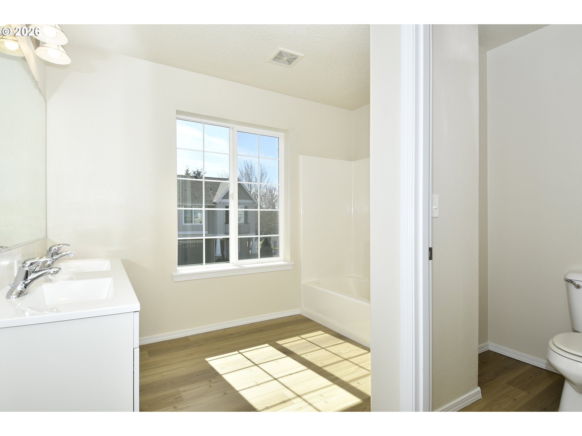 20477 Southwest Marimar Street Beaverton, OR 97078 - Photo 21 of 28 a bathroom with a sink a toilet and a window