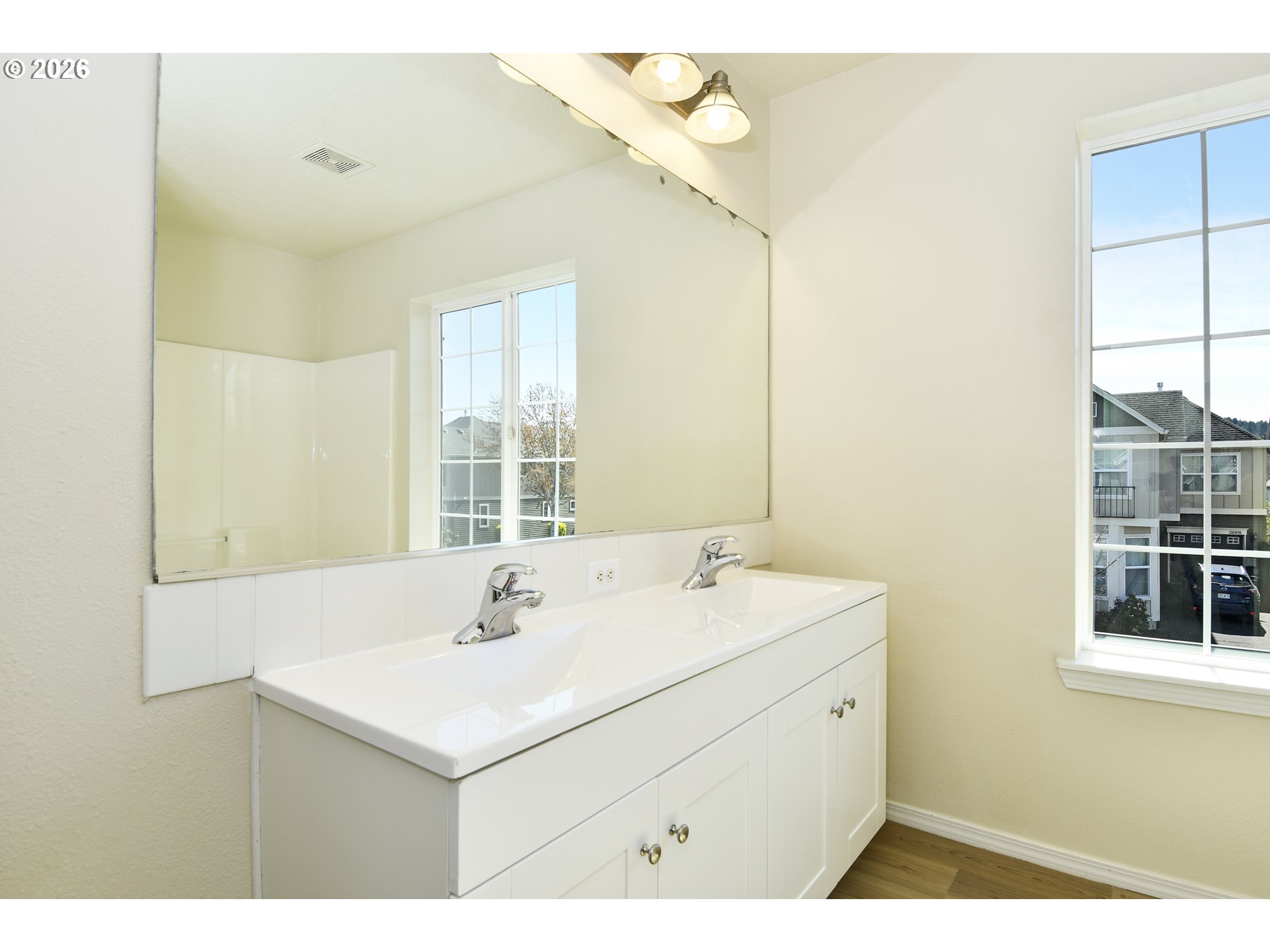 20477 Southwest Marimar Street Beaverton, OR 97078 - Photo 22 of 28 a bathroom with a sink and a mirror